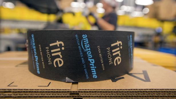 Packing tape sits atop a box at an Amazon Fulfillm