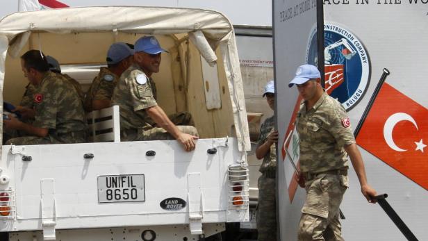 A U.N. vehicle carrying Turkish peacekeepers of UN