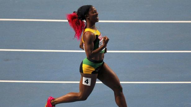 Shelly-Ann Fraser-Pryce of Jamaica celebrates winning the women&#039;s 100 metres final during the IAAF World Athletics Championships at the Luzhniki Stadium in Moscow August 12, 2013. REUTERS/Gary Hershorn (RUSSIA - Tags: SPORT ATHLETICS)