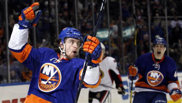 New York Islanders right wing Michael Grabner celebrates scoring against the Ottawa Senators in the third period of their NHL hockey game in Uniondale, New York, March 3, 2013. REUTERS/Adam Hunger (UNITED STATES - Tags: SPORT ICE HOCKEY TPX IMAGES OF THE DAY)