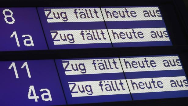 An information board for train departures of German railway Deutsche Bahn reads, &quot;train is not running&quot;, at the main train station in Mainz August 12, 2013. German rail operator Deutsche Bahn cancelled most of its regional service in Mainz due to lack of personnel. The Mainz railway control centre is severely understaffed, out of 15 traffic controllers eight called in sick or are on vacation according to local media. REUTERS/Ralph Orlowski (GERMANY - Tags: TRANSPORT BUSINESS EMPLOYMENT)