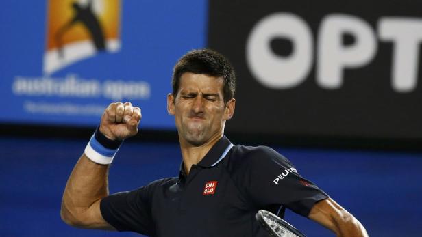 Novak Djokovic of Serbia celebrates after defeatin