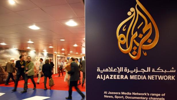 The logo of Al Jazeera Media Network is seen at the MIPTV, the International Television Programs Market, event in Cannes in this April 2, 2012 file photo. Al Jazeera said on January 3, 2013 it will buy Current TV, the struggling cable channel founded by Al Gore and partners, in a move that will boost the Qatar-based broadcaster&#039;s footprint in the United States. REUTERS/Eric Gaillard/Files (FRANCE - Tags: MEDIA BUSINESS LOGO POLITICS)