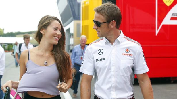 McLaren Formula One driver Jenson Button of Britain and girlfriend, Japanese-Argentine model Jessica Michibata arrive at the Hungaroring circuit, near Budapest, July 25, 2013. The Hungarian F1 Grand Prix will be held on Sunday. REUTERS/Laszlo Balogh (HUNGARY - Tags: SPORT MOTORSPORT F1)