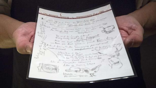 An employee shows the handwritten lyrics for Bob D
