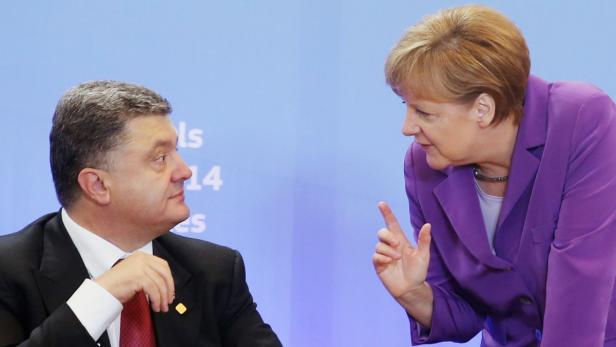 Poroschenko, Merkel: „Historischer Tag“ für die Beziehungen zwischen der Ukraine und der EU