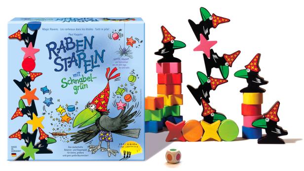 Das Spiel „Raben Stapeln“ mit bunten Holzfiguren und einem Würfel.