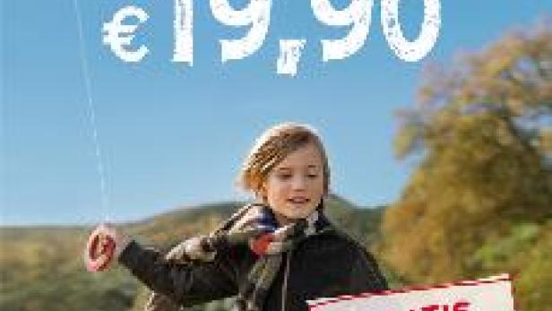 Ein Kind lässt einen Drachen steigen, beworben wird ein Kombi-Angebot für Internet und Telefonie.