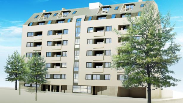 Ein modernes Mehrfamilienhaus mit Bäumen im Vordergrund unter blauem Himmel.