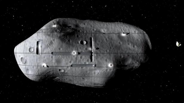 Ein Asteroid mit Gitternetzstruktur und Lichtern im Weltraum.
