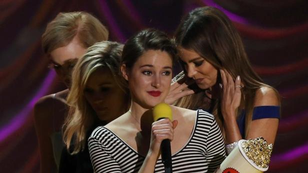 Actress Shailene Woodley accepts the award for Bes