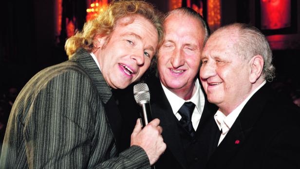 Thomas Gottschalk mit Hape Kerkeling und Mel Brooks bei einer Veranstaltung.