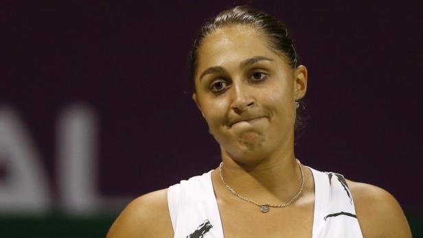 Tamira Paszek of Austria reacts after losing a point against Ana Ivanovic of Serbia during their women&#039;s match at the Qatar Open tennis tournament in Doha February 11, 2013. REUTERS/Fadi Al-Assaad (QATAR - Tags: SPORT TENNIS)