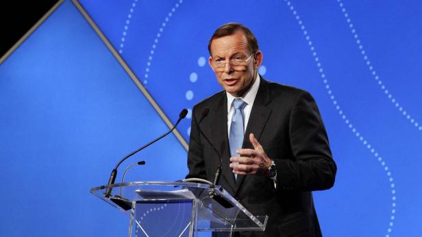Australian Prime Minister Tony Abbott delivers his keynote speech during the B20 Summit in Sydney, July 17, 2014. The Group of 20 advanced and emerging countries has not enacted the policies needed to reach its growth targets, Abbott said on Thursday, casting fresh doubt on the ambitious roadmap laid out by the group earlier this year. Abbott told a meeting of the Business 20 leaders in Sydney on Thursday that member countries would fall short by as much as half of their goal of raising collective GDP by an additional 2 percent over five years if they did not take stronger measures. REUTERS/Lisa Maree Williams/Pool (AUSTRALIA - Tags: POLITICS BUSINESS)