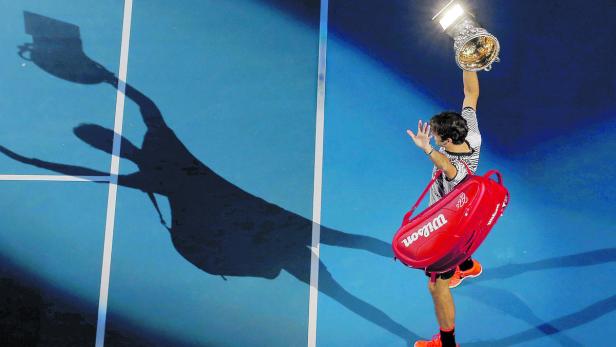 Tennis-Spieler Roger Federer macht eine Siegerpose