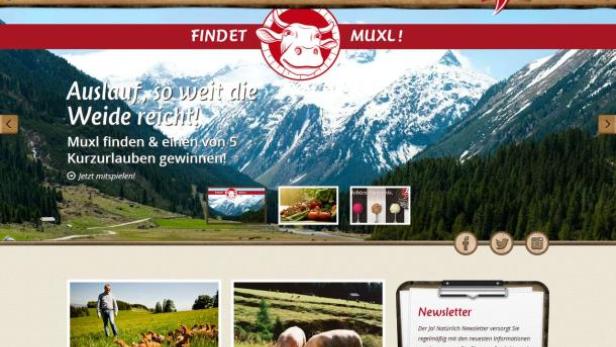 Die Webseite „Ja! Natürlich“ mit dem Slogan „Auslauf, so weit die Weide reicht!“ vor Bergkulisse.