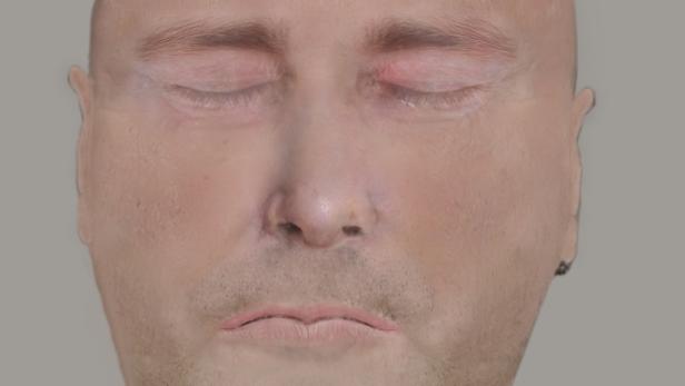 Das Gesicht eines Mannes mit geschlossenen Augen.