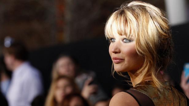 Cast member Jennifer Lawrence poses at the premier