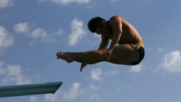 Austria's Blaha performs a dive at the men's 3m sp