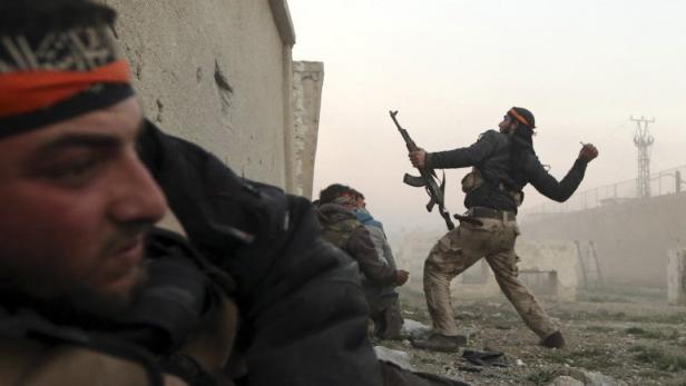 A Free Syrian Army fighter throws a hand grenade inside a Syrian Army base during heavy fighting in the Arabeen neighbourhood of Damascus in this February 3, 2013 file photograph. The civil war that has unfolded in Syria over the past two and a half years has killed more than 100,000 people and driven millions from their homes. Now, in the wake of last week&#039;s chemical weapons attack near Damascus, the world is waiting to see what action Western powers will take and what impact this will have on the Middle Eastern nation and the rest of the volatile region. REUTERS/Goran Tomasevic/Files (SYRIA - Tags: CIVIL UNREST CONFLICT POLITICS) ATTENTION EDITORS: PICTURE 29 OF 40 FOR PACKAGE &#039;SYRIA - A DESCENT INTO CHAOS.&#039; SEARCH &#039;SYRIA TIMELINE&#039; FOR ALL IMAGES