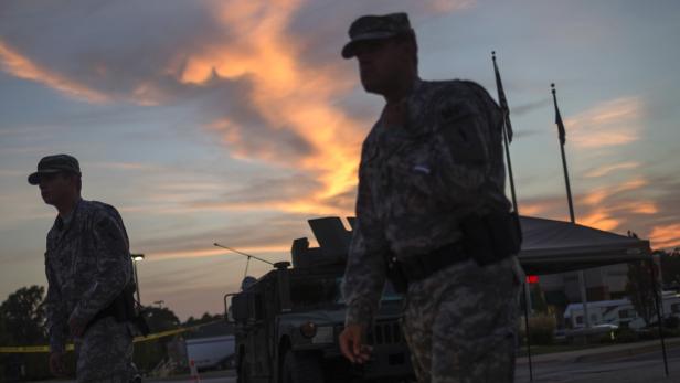 National Guard troops stand guard at a staging are