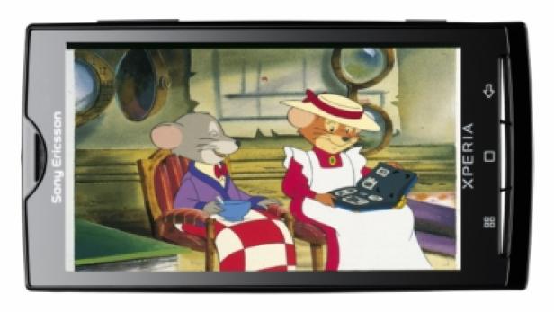 Ein Smartphone zeigt eine Szene aus der Zeichentrickserie „Familie Maus“.