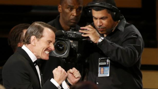Actor Bryan Cranston reacts as he takes the stage