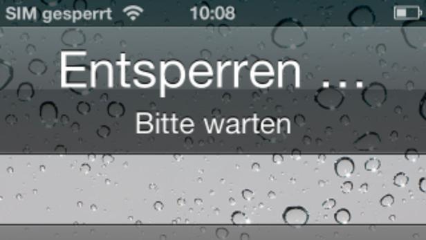 Ein Smartphone-Bildschirm zeigt die Meldung „Entsperren … Bitte warten“.