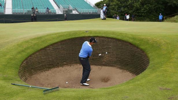 REUTERSManuel Trappel of Austria hits out of a bunker on the 12th hole during a practice round ahead of the British Open golf championship at Royal Lytham and St Annes, northern England July 16, 2012. REUTERS/Eddie Keogh (BRITAIN - Tags: SPORT GOLF) Golf: Trappel bei British Open out