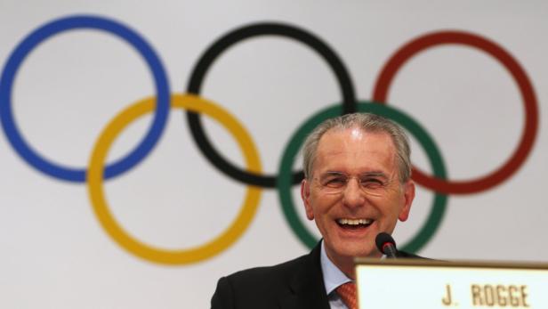 International Olympic Commitee (IOC) president Jacques Rogge of Belgium laughs during a news conference in Buenos Aires September 4, 2013. The IOC will elect the host city for the 2020 Summer Olympics at their session on Saturday. REUTERS/Enrique Marcarian (ARGENTINA - Tags: SPORT OLYMPICS)