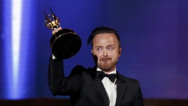Aaron Paul leaves the stage after accepting the aw