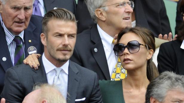 David und Victoria Beckham sitzen im Publikum.