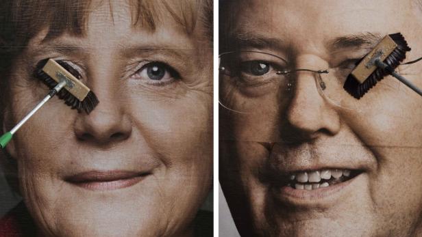 A combination of pictures shows workers pasting up posters of top candidates running in the upcoming German general elections in Berlin, September 6, 2013. Pictured are German Chancellor Angela Merkel (L) of the Christian Democratic Union (CDU) and Peer Steinbrueck of the Social Democratic Party (SPD). Angela Merkel, dropping her trademark modesty as the election looms, urged Germans this week to re-elect what she repeatedly called her &quot;clever&quot; government which she promised would shield their businesses and jobs from tax hikes by the centre left. German voters will take to the polls in a general election on September 22. REUTERS/Thomas Peter (GERMANY - Tags: ELECTIONS POLITICS)