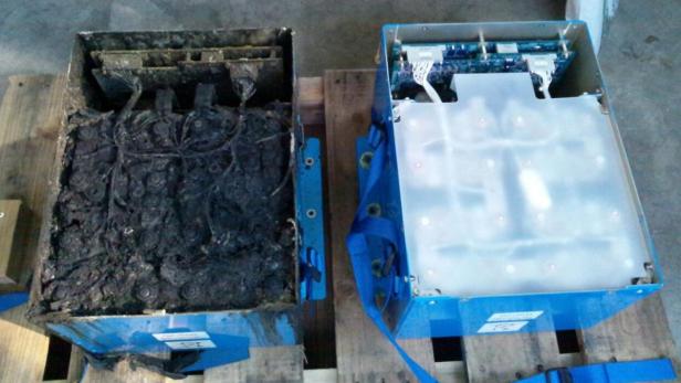 The burnt auxiliary power unit battery, removed fr