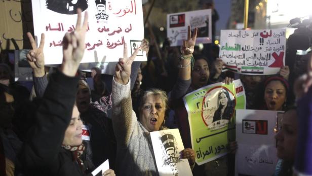 Women chant slogans as they participate in a protest against sexual harassment, in central Cairo February 12, 2013. REUTERS/Asmaa Waguih (EGYPT - Tags: POLITICS CIVIL UNREST SOCIETY)