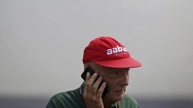 Former Formula One champion Lauda talks on his pho