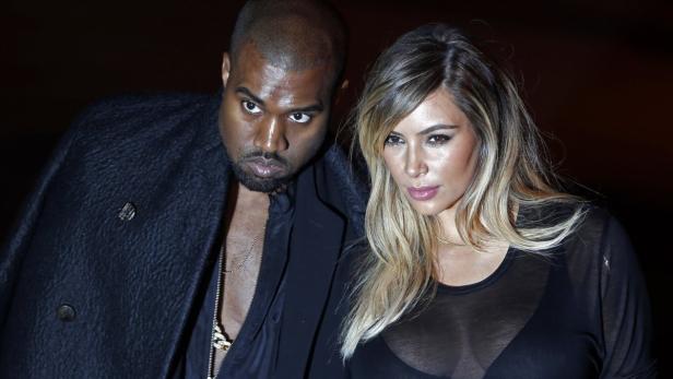 Kanye West and Kim Kardashian arrive at the Givenc