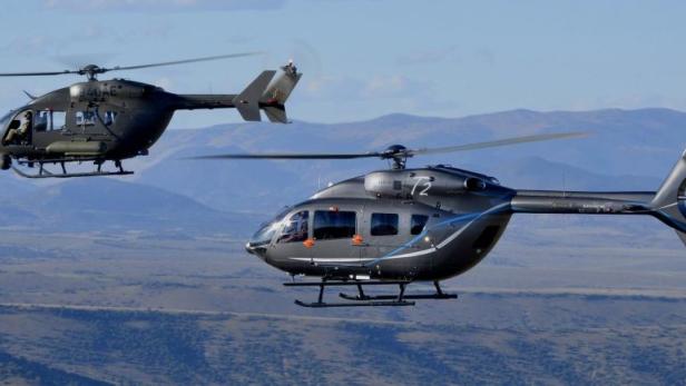 Two variants of the European Aeronautic Defence and Space Company (EADS) North America Inc&#039;s UH-72A Lakota Light Utility Helicopter fly over the mountains around Alamosa, Colorado, in this handout image released to Reuters on October 18, 2012. The aircraft on the left, N940AE, is equipped with armed scout mission equipment, and the one on the right, T2, has a tail and engines that will be offered on the AAS-72X+ model. Europe&#039;s EADS on October 18, 2012 said it has invested tens of millions of dollars to develop an armed helicopter for a possible U.S. Army competition, and will look to team up with defence contractors to pump up its non-Airbus U.S. sales to $10 billion by 2020. REUTERS/James Darcy/EADS North America/Handout (UNITED STATES - Tags: MILITARY TRANSPORT BUSINESS) FOR EDITORIAL USE ONLY. NOT FOR SALE FOR MARKETING OR ADVERTISING CAMPAIGNS. THIS IMAGE HAS BEEN SUPPLIED BY A THIRD PARTY. IT IS DISTRIBUTED, EXACTLY AS RECEIVED BY REUTERS, AS A SERVICE TO CLIENTS