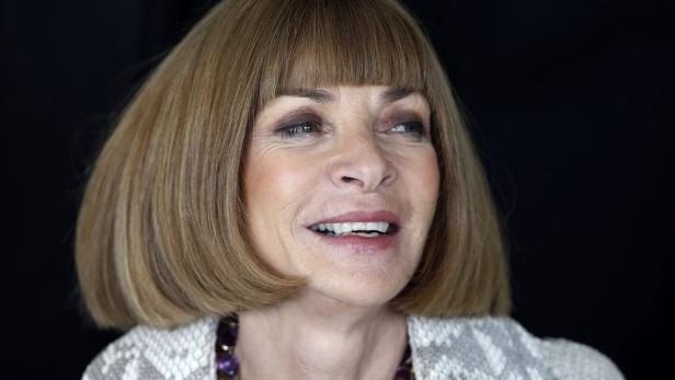Vogue editor Anna Wintour laughs during an interview before the Christopher Kane Spring/Summer 2013 collection presentation at London Fashion Week September 17, 2012. REUTERS/Suzanne Plunkett (BRITAIN - Tags: FASHION ENTERTAINMENT)