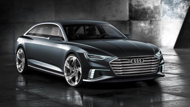 Ein grauer Audi A9 Concept vor einer Betonwand.