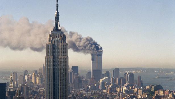 dapdFILE - In this Sept. 11, 2001, file photo, the twin towers of the World Trade Center burn behind the Empire State Building in New York. The twin towers stood as New Yorks tallest from 1972 until the terrorist attacks of Sept. 11, 2001, when two planes