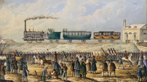 Ein Bild einer der ersten Versuchsfahrten im November 1837. Die &quot;Austria&quot; fährt aus dem Bahnhof Deutsch-Wagram.