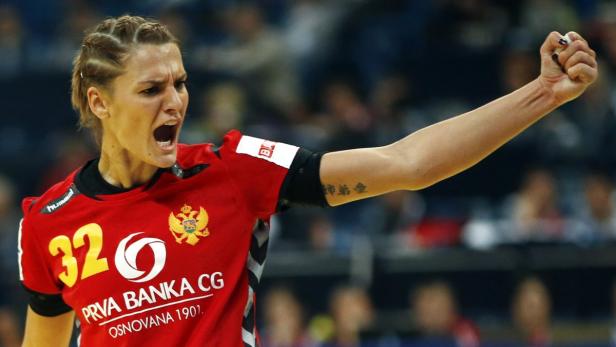 Montenegro's Bulatovic reacts after scoring agains Montenegro's Katarina Bulatovic reacts after scoring against Norway during their women's European handball championship final match at the Kombank Arena in Belgrade December 16, 2012. REUTERS/Marko Djurica (SERBIA - Tags: SPORT HANDBALL)