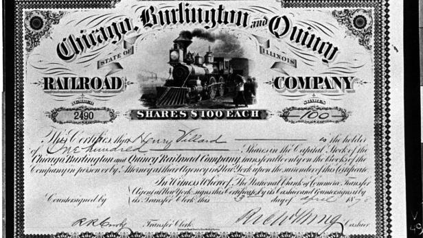 Ein historisches Aktienzertifikat der Chicago, Burlington and Quincy Railroad Company mit einer Dampflokomotive.