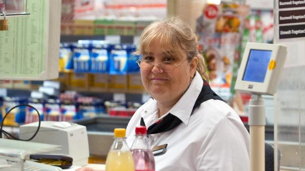 epa02215769 Supermarket cashier Barbara Emmely sits at a check-out counter of a Kaiser&#039;s supermarket chain shop for the first time since two years after she returned to her job in Berlin, Germany, on 22 June 2010. Following a labour dispute the German Federal Labour Court had ruled the employer of Emmely to re-hire her after she was fired in 2008 over encashing two abandoned bottle deposit coupons worth 1.3 Euros. EPA/SOEREN STACHE