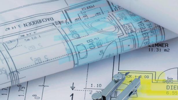 Ein Bauplan eines Architekten mit einem Taschenrechner. Symbolfoto für Finanzierung und Planung eines neuen Hauses.