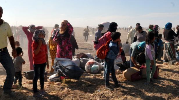 Hunderte Flüchtlinge an der syrisch-türkischen Grenze, am 19. September 2014.