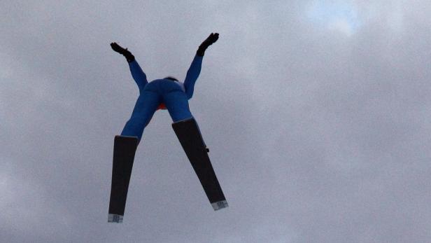 A ski jumper soars through air during a training session of the FIS World Cup Ski Jumping competition in Zakopane January 11, 2013. REUTERS/Peter Andrews (POLAND - Tags: SPORT SKIING)