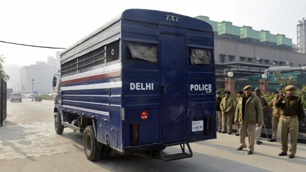 A police van carrying five men accused of the gang rape and murder of an Indian student arrives at a court in New Delhi January 7, 2013. Five men accused of the gang rape and murder of an Indian student appeared in court on Monday to hear charges against them, after two of them offered evidence possibly in return for a lighter sentence in the case that has led to a global outcry. The five men, along with a teenager, are accused of raping the 23-year-old physiotherapy student on a bus in New Delhi. She died two weeks later on December 28 in a Singapore hospital. REUTERS/Stringer (INDIA - Tags: CRIME LAW CIVIL UNREST POLITICS TPX IMAGES OF THE DAY)
