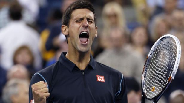 Novak Djokovic of Serbia celebrates defeating Mikhail Youzhny of Russia during their quarter-final match at the U.S. Open tennis championships in New York, September 5, 2013. REUTERS/Mike Segar (UNITED STATES - Tags: SPORT TENNIS TPX IMAGES OF THE DAY)
